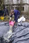 Glasgow University Wildlife Garden - Eilidh pouring water back into the pond