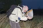 Roger Downie examining a pond dipping net, Robroyston Park local nature reserve