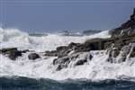 sea breaking over rocks with boat, Staffa